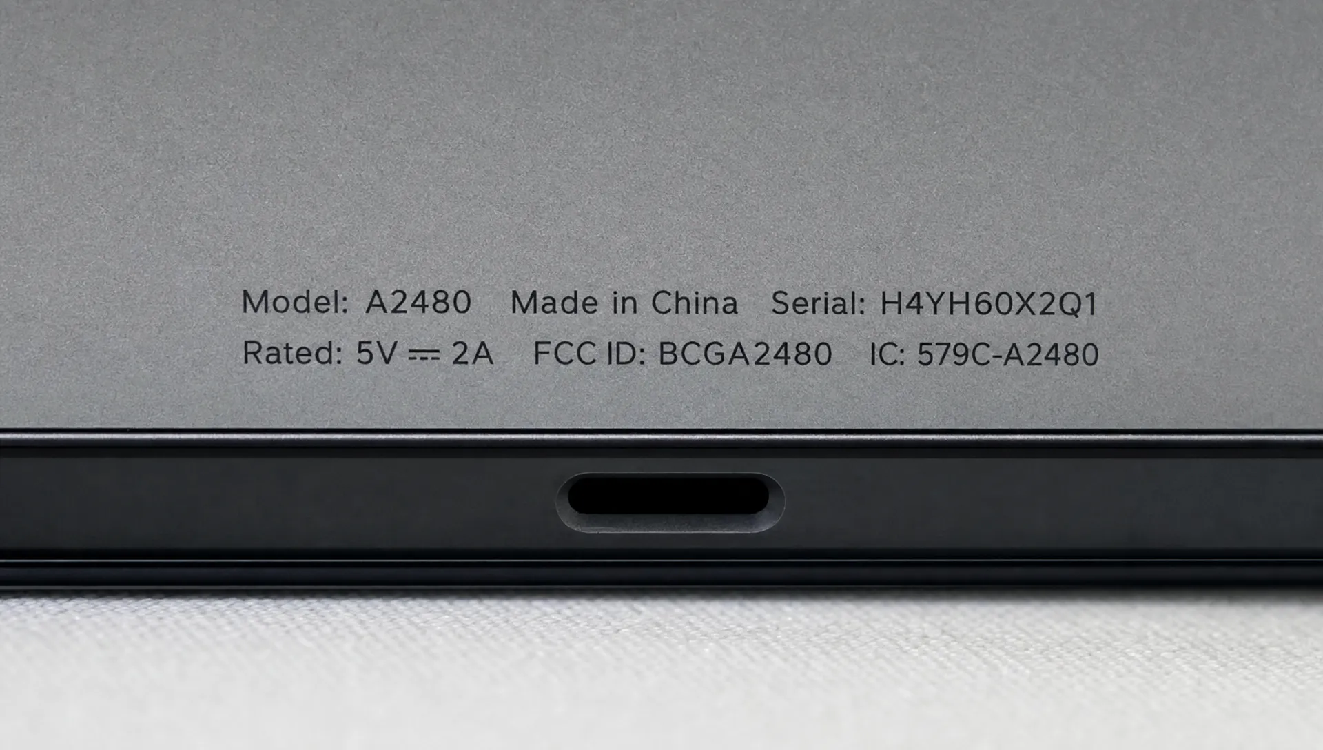 A close-up of a small text label and thin product edge shows sharper letters and cleaner outlines after enhancement.